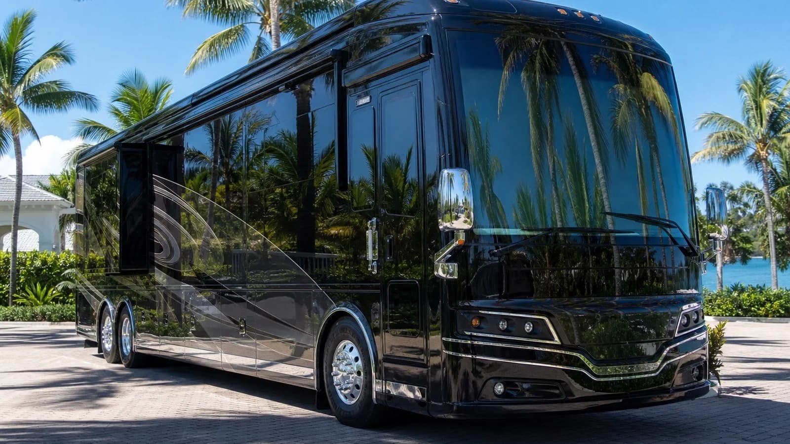 Unbranded premium Class A motorcoach with a high-gloss finish parked in a Florida Keys tropical setting